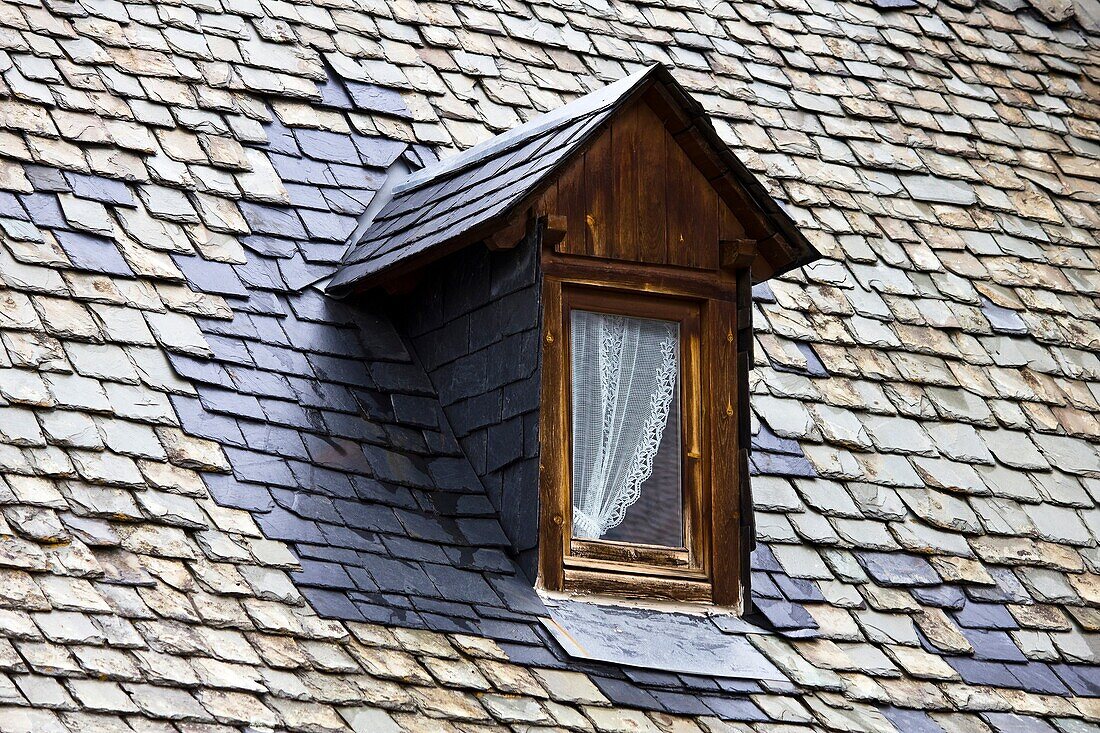 Slate roof and mansard in a house typical of Arties- Valle de Aran - Pyrenees - Lleida Province - Catalonia - Cataluña - Spain