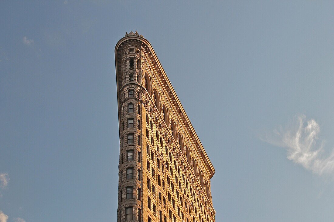 The Flatiron Building built in 1902 in the late afternoon sunlight, Manhattan, New York City