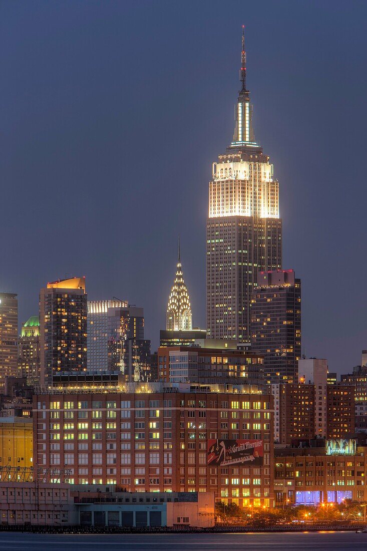 The Empire State Building, Chrysler Building, and other Manhattan skyscrapers at twilight, New York City, New York, USA