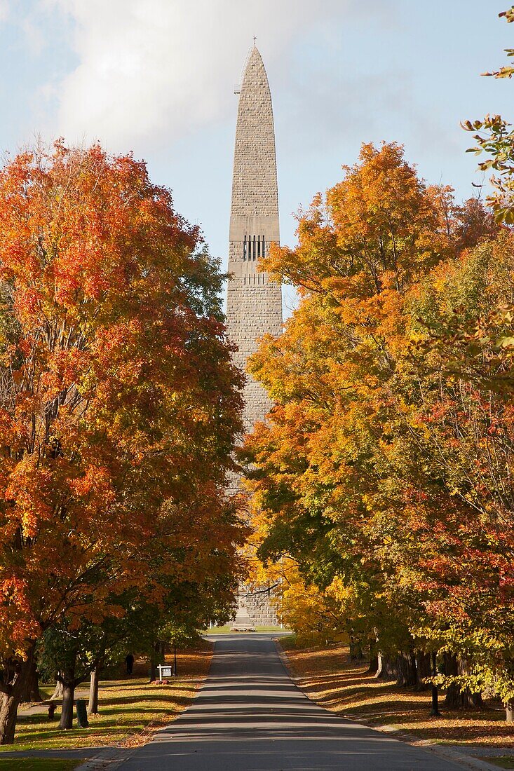 The Bennington Battle Monument and fall foliage along Monument Avenue in Bennington, Vermont, USA