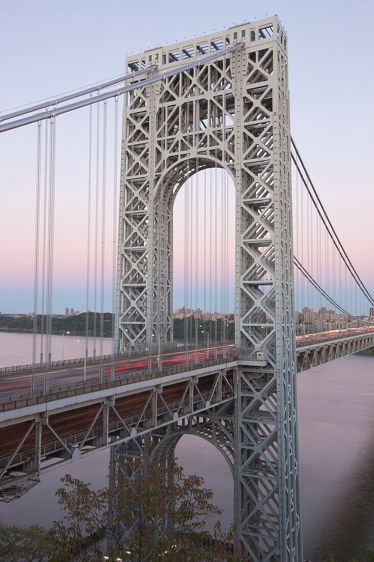 The George Washington Bridge and evening traffic crossing the Hudson River into Manhattan from New Jersey, USA