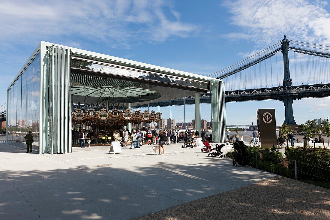 People visiting the newly restored historic Jane´s Carousel in Brooklyn Bridge Park in New York City, New York, USA