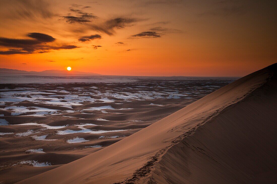 Khongur sand dunes, Sevrei mountains, sunset, winter in Gobi desert, Mongolia