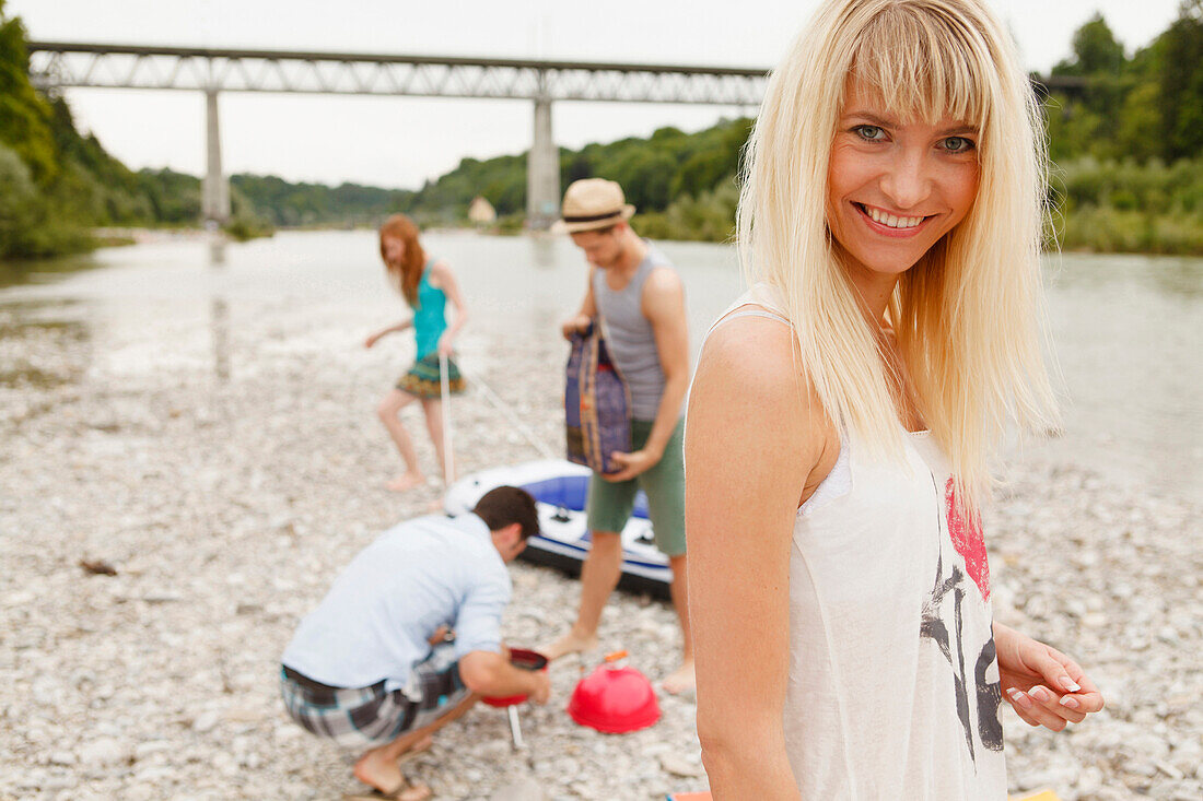Young people barbecueing at the Isar river, Munich, Bavaria, Germany