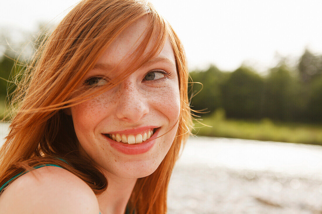 Young woman at the Isar river, Munich, Bavaria, Germany