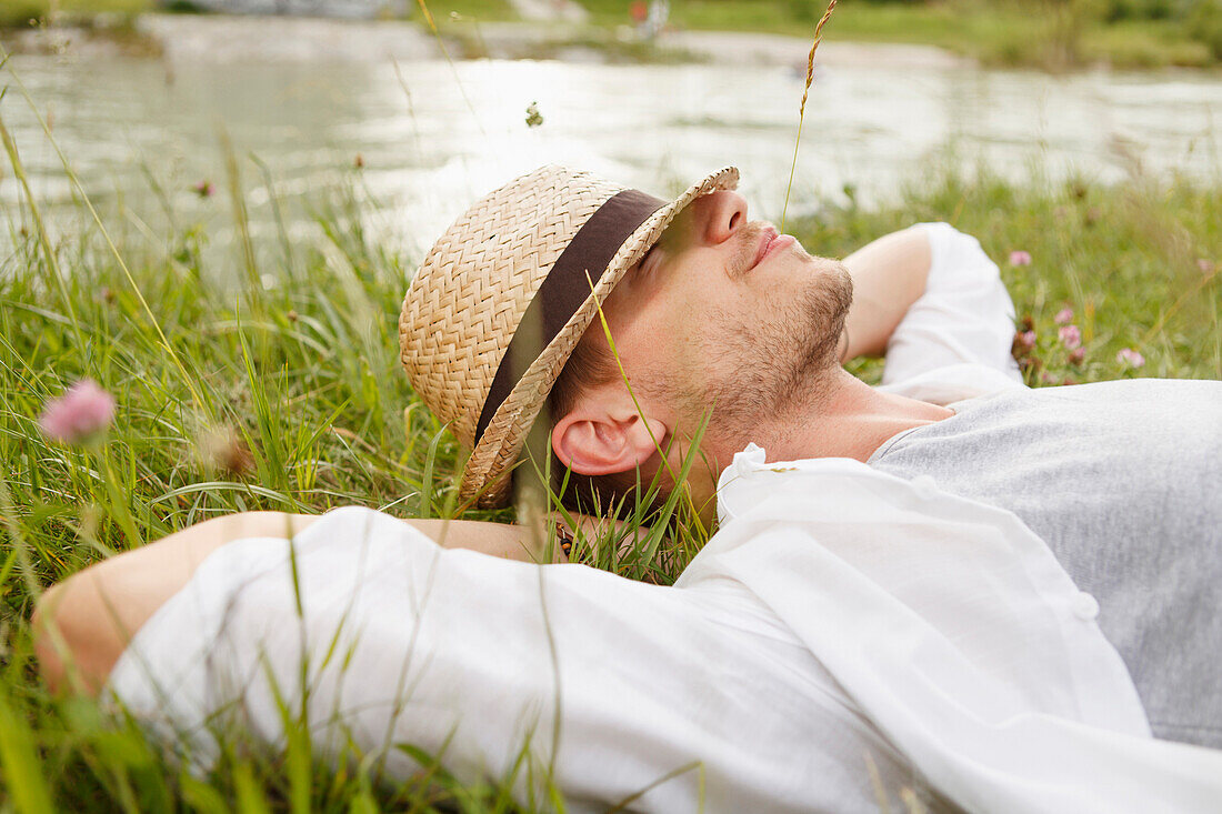 Young man at the Isar river, Munich, Bavaria, Germany