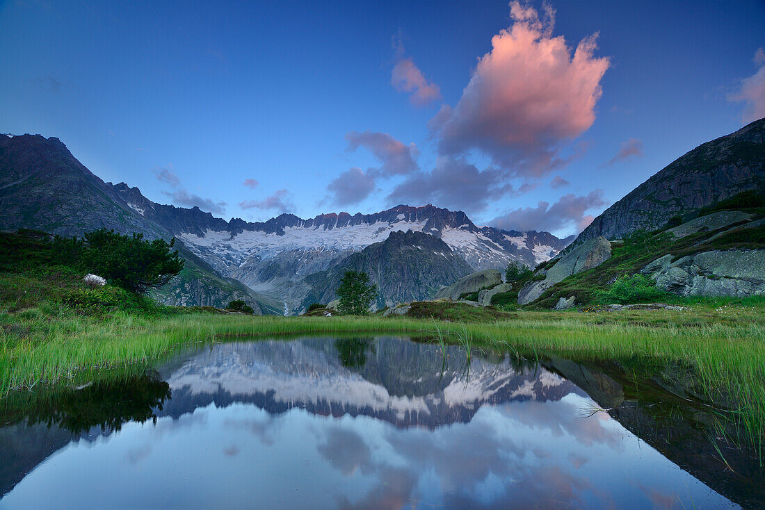 Dammastock reflecting in mountain lake, Dammastock, Urner Alps, Uri, Switzerland