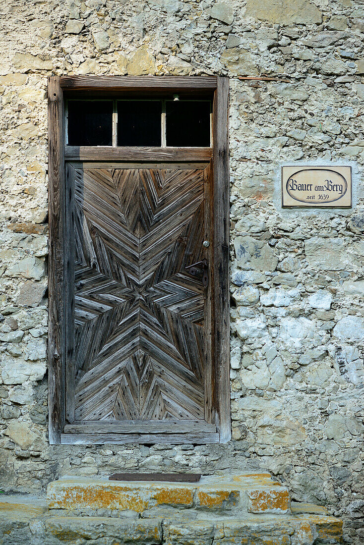 Wooden door of a farm house, Petersberg, Kleiner Madron, valley of Inntal, Mangfall range, Bavarian Alps, Upper Bavaria, Bavaria, Germany