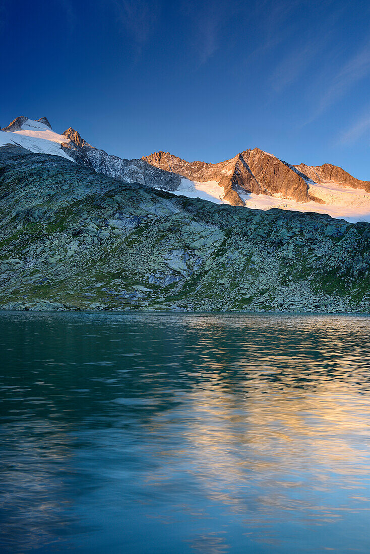 Reichenspitze range reflecting in a mountain lake, Reichenspitze range, Gerlos, Zillertal range, Tyrol, Austria