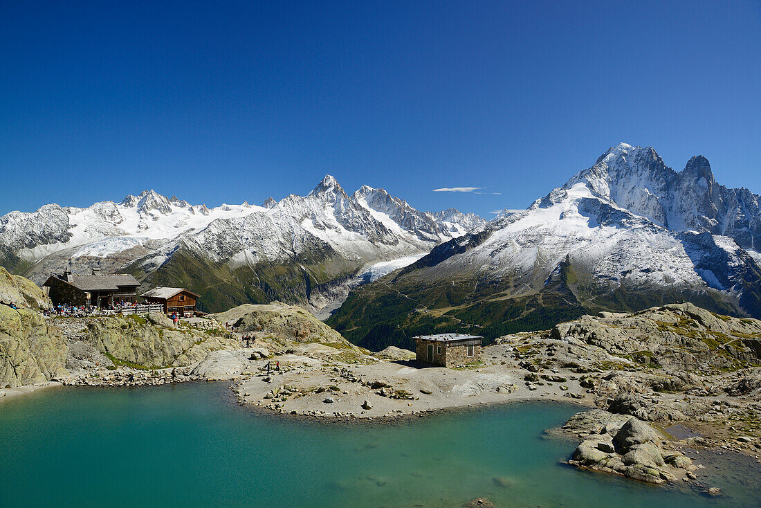 Lac Blanc with Chalet du Lac Blanc, Mont Blanc range in background with Aiguille du Chardonnet, Aiguille d' Argentiere, Aiguille Verte and Grand Dru, Montblanc range, Chamonix, Savoy, France