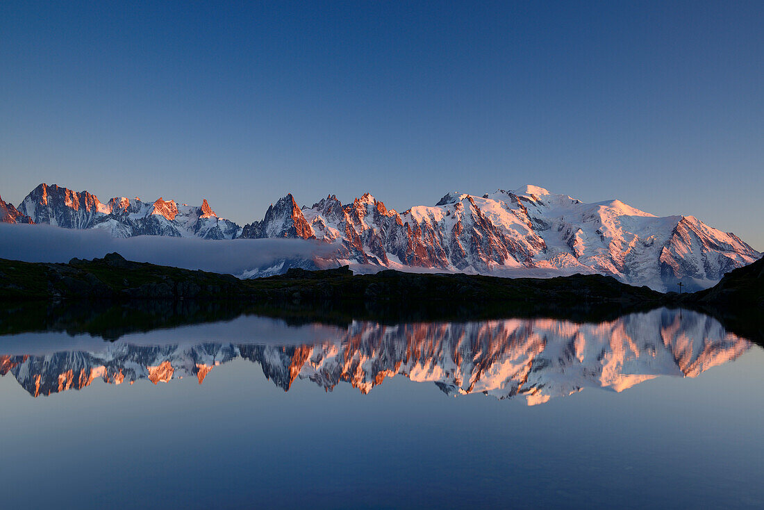 Mont Blanc range reflecting in a mountain lake, Mont blanc range, Chamonix, Savoy, France