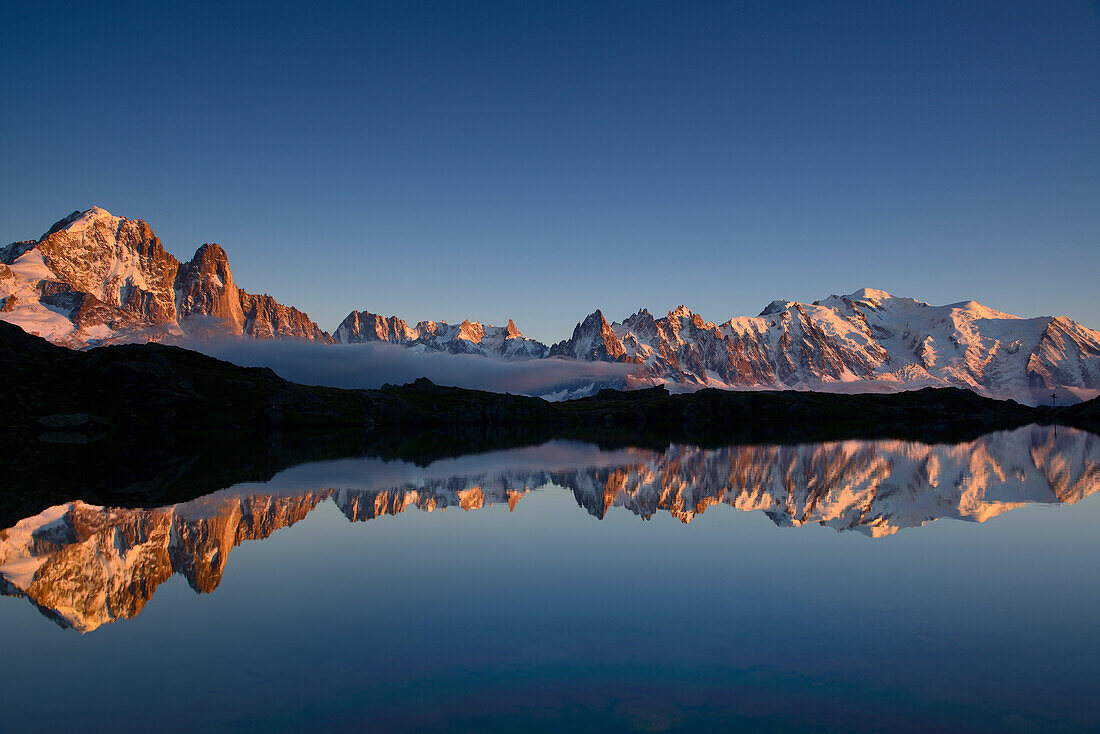 Mont Blanc range reflecting in a mountain lake, Mont blanc range, Chamonix, Savoy, France