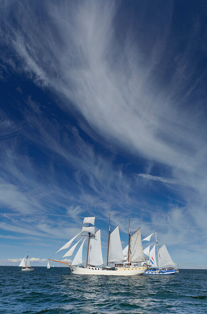 Sailing ships und cirrus clouds above Baltic Sea of Warnemuende, Mecklenburg Western Pomerania, Germany, Europe