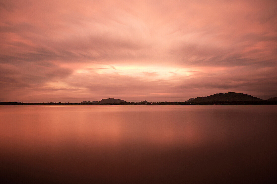 Artificial lake Tissa Wewa with clouds and long time exposure, Hambantota District, Tissamaharama, Sri Lanka