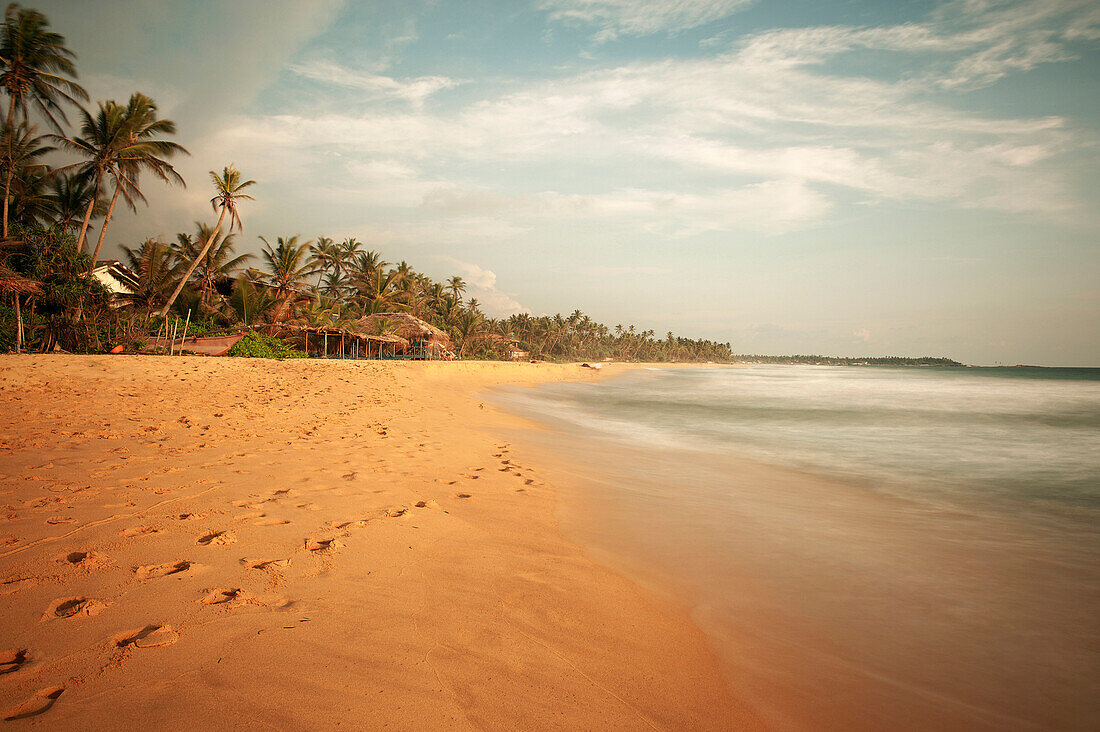 Long stretch of sandy beach, long time exposure, Hikkaduwa, Galle District, Sri Lanka, Indian Ocean