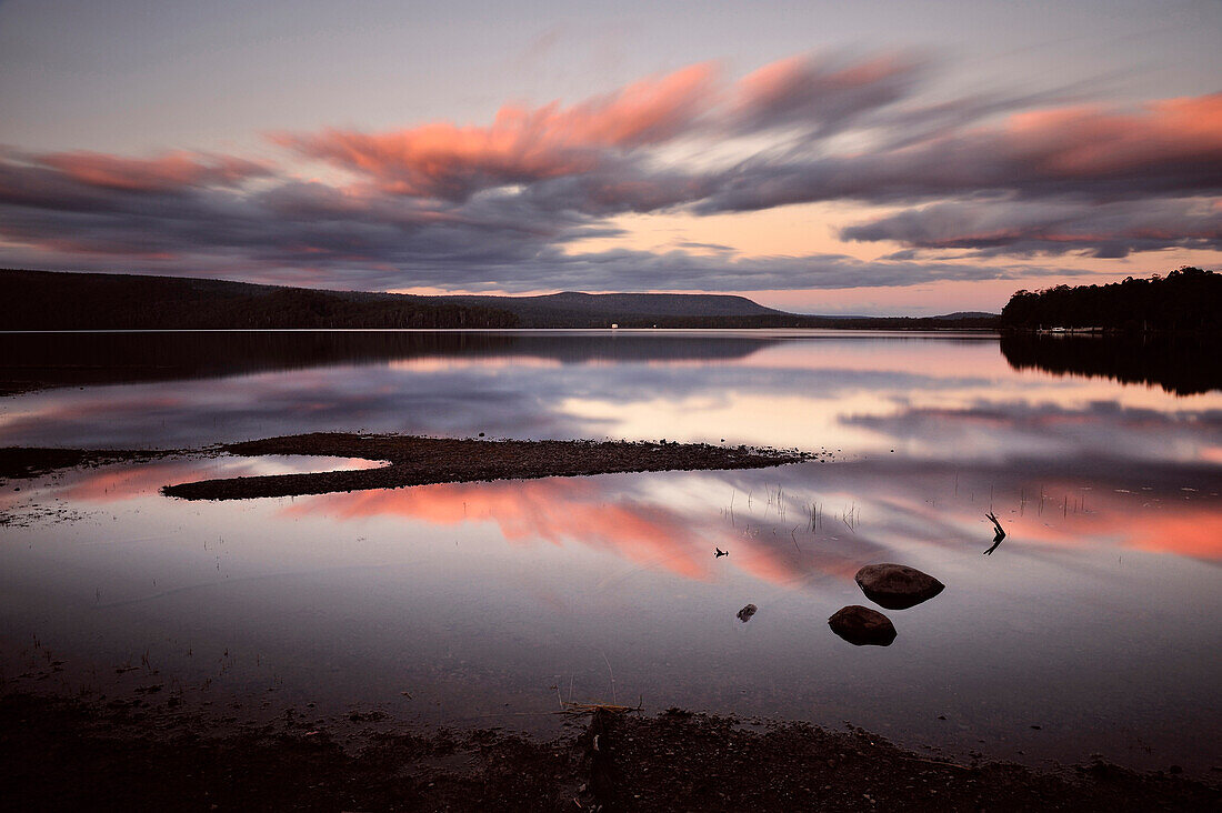 Red clouds during sunset at Lake St Clair, Overland Track, Cradle Mountain Lake St Clair National Park, Tasmania, Australia