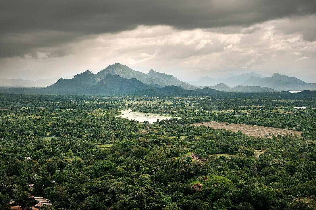 View from monolith of Sigiriya rock fortress at surrounding jungle during in storm, cultural triangle, UNESCO world heritage, Sri Lanka