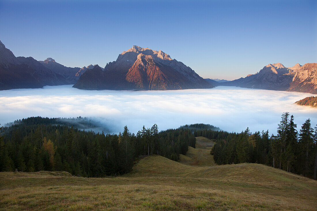 View over the fog in the valley onto Hochkalter and Reiteralpe, Berchtesgaden region, Berchtesgaden National Park, Upper Bavaria, Germany, Europe