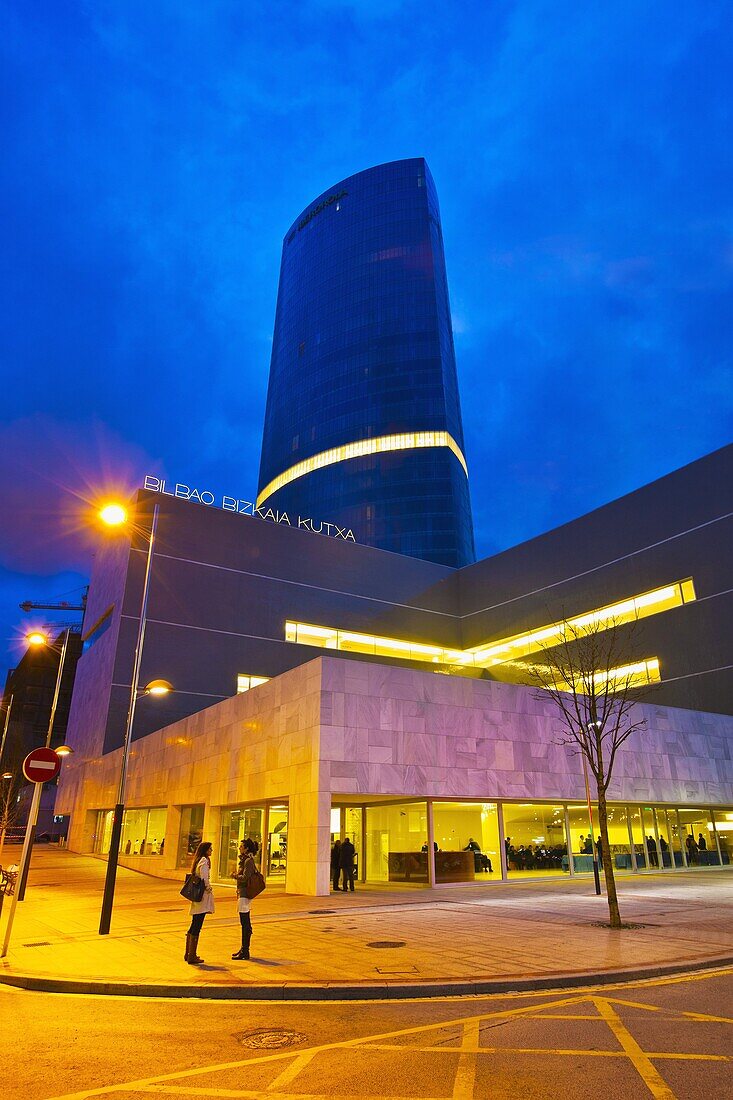 In the foreground Iberdrola tower and “Bizkaia Aretoa”  Auditorium  Assembly hall  Pais Vasco University  “UPV “  Designer Alvaro Siza  In the background Iberdrola tower  Skyscraper  165 meters  Designer Cesar Pelli  Abandoibarra avenue  Bilbao  Bizkaia. 