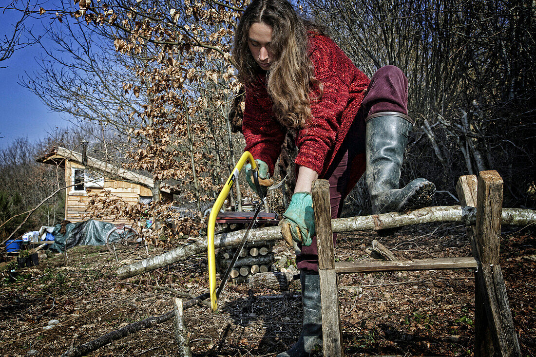 Lorelei Cutting Firewood, She Left Everything Behind To Come Build And Live In Her Wood Cabin In The Creuse, France