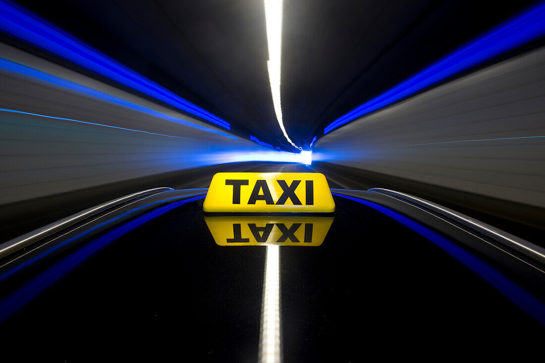 A taxi cab in a tunnel