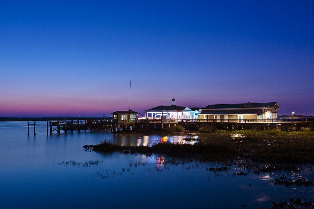 Jekyll Island, Jekyll Island Pier and Latitude 31 Restaurant, at dusk. Resort island on the coast of Georgia.