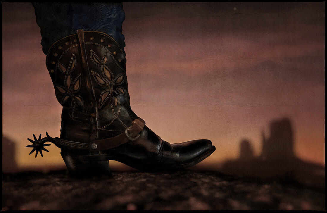 Cowboy boot and The Mittens at sunset, Monument Valley, Arizona, USA, America