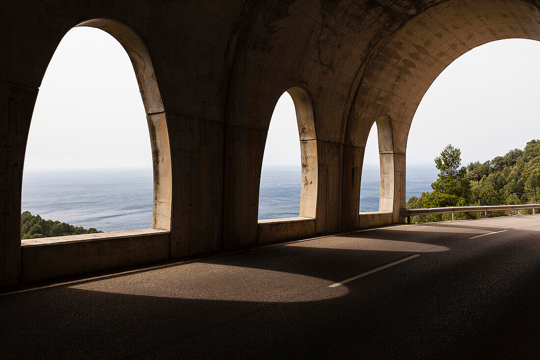Coast road tunnel at Mediterranean Sea, Estellencs, Mallorca, Spain