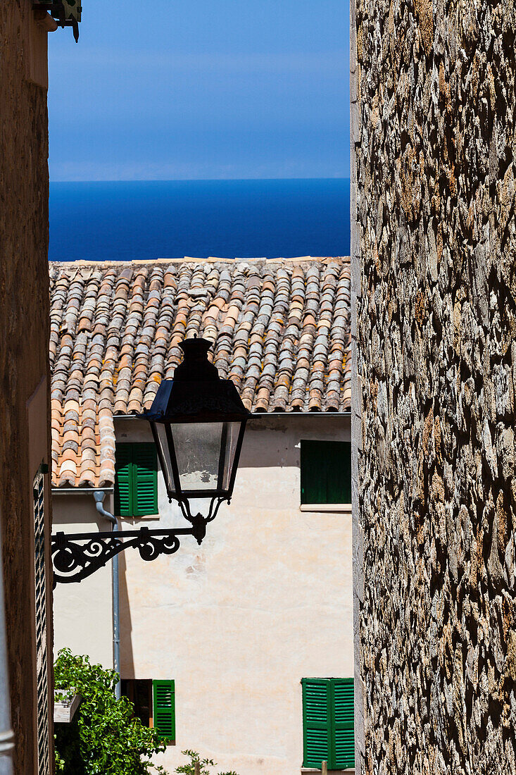 Streen latern between houses at Mediterranean Sea, Banyalbufar, Mallorca, Spain