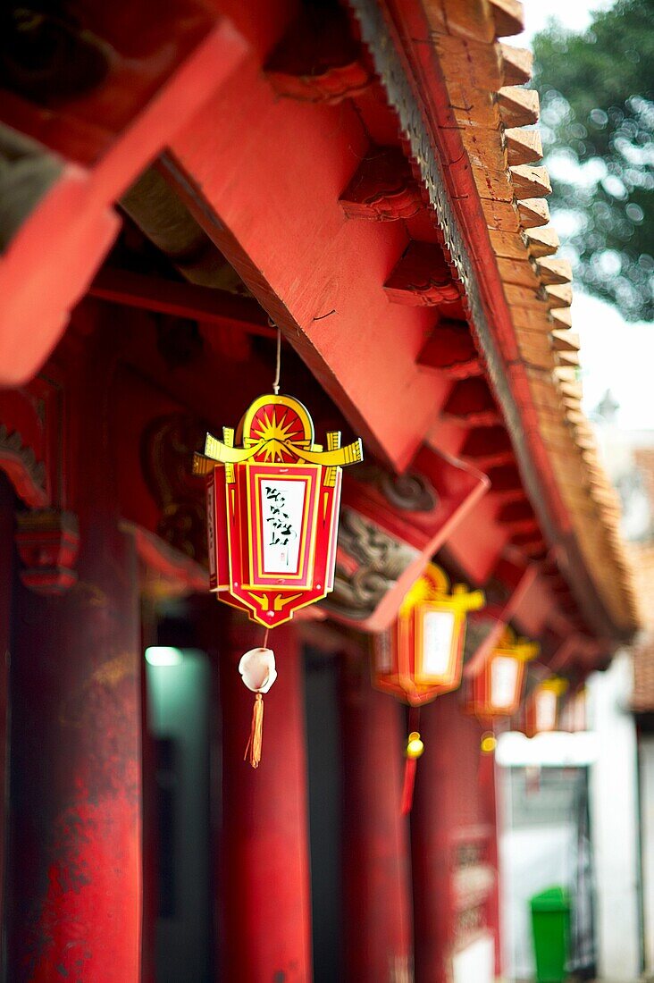 An ornamental lantern hanging from the roof at The Temple of Literature in Hanoi, Vietnam