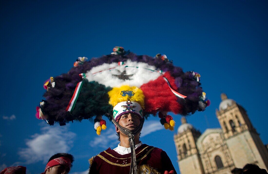 A dancer performs the Dance of the Feather or Danza de la Pluma during the Guelaguetza parade in front of the Santo Domingo church in Oaxaca, Mexico, July 21, 2012  Oaxaca commemorates the ´Guelaguetza,´ an annual celebration by all seven of the state´s r