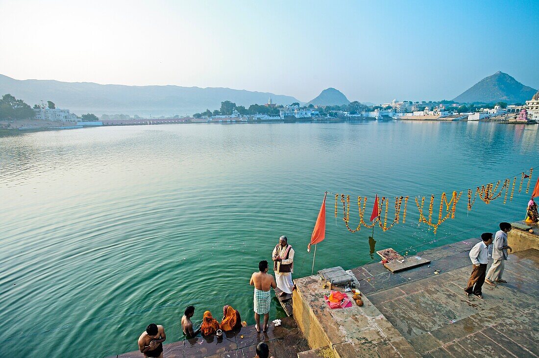 Pilgrims bathing in the Pushkar Holy lake during the Pushkar camel fair  Pushkar  Rajasthan  India  Asia