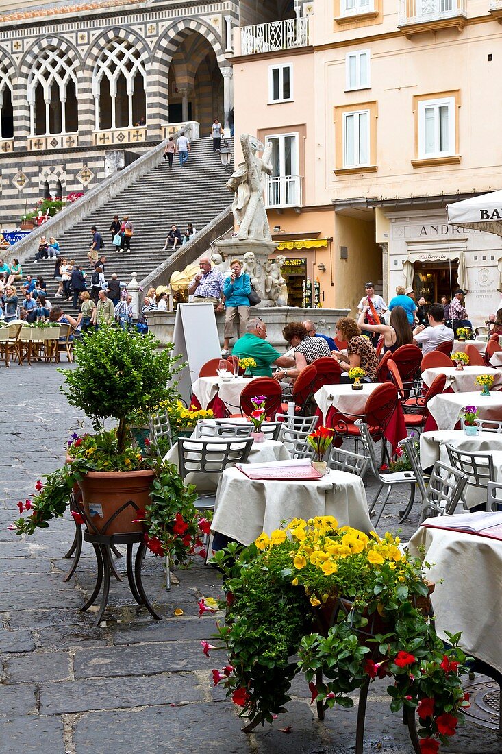 An outdoor restaurant in the town of Amalfi on the Gulf of Salerno in southern Italy