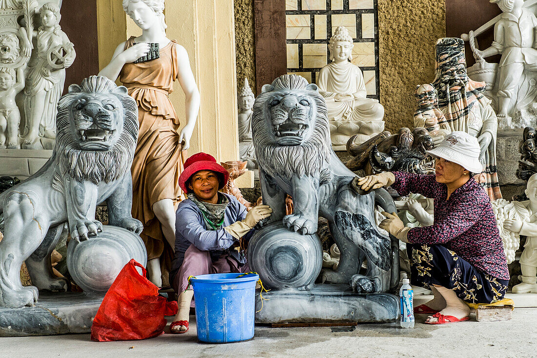 Women polishing marble figures, near the City of Hoi An, Vietnam, Asia