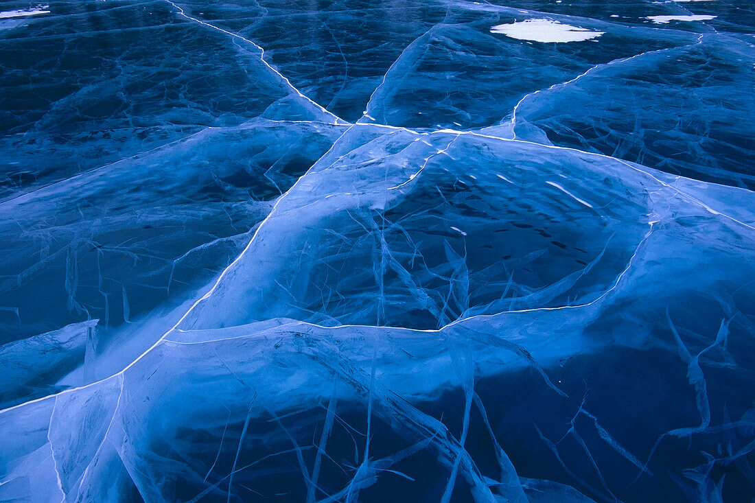 Cracked ice Long Lake along Glenn Hwy Southcentral AK winter close-up
