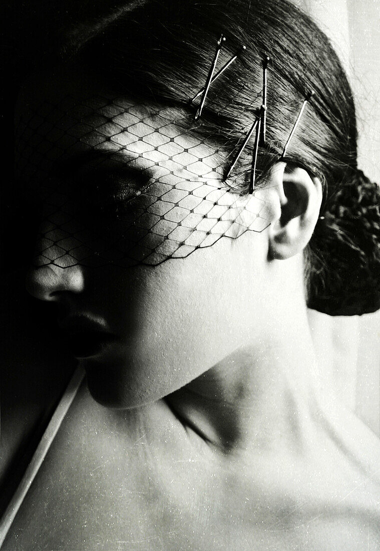 Young Woman With Netted Vail Covering Face, Portrait