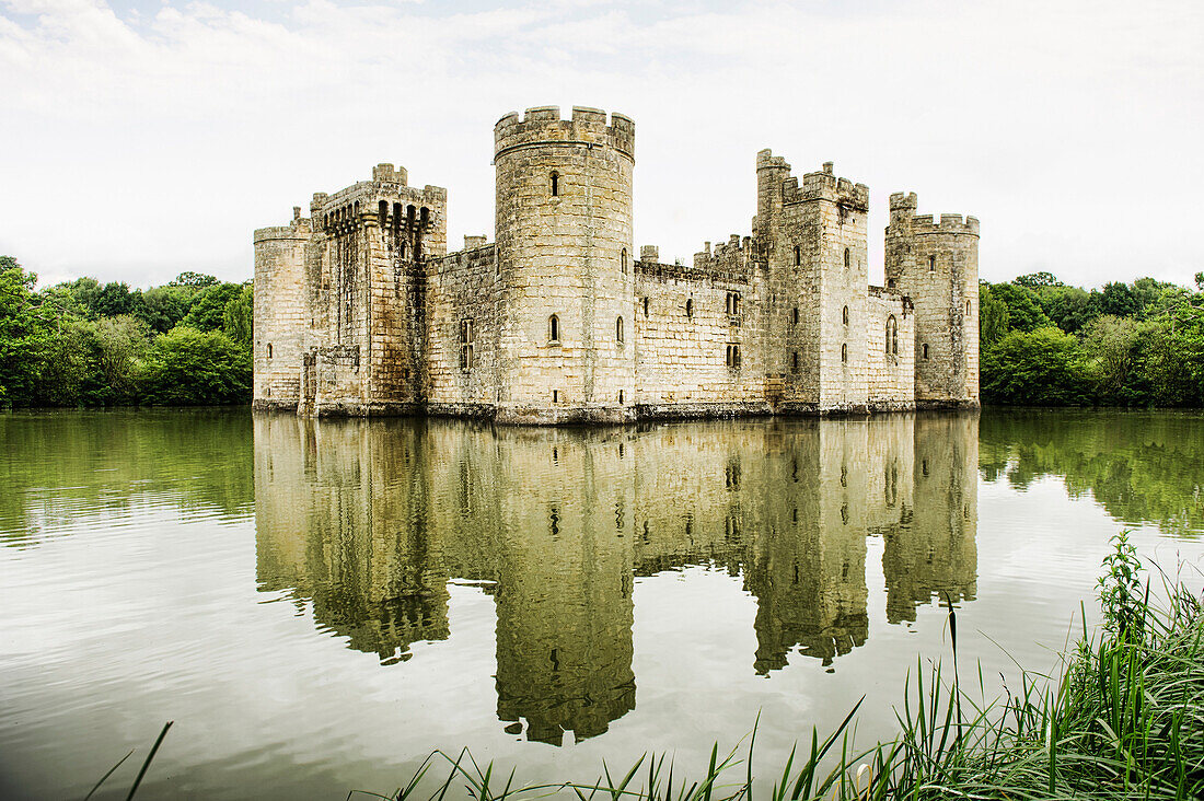 A medieval moated 14th century stone built castle, a fortified building.