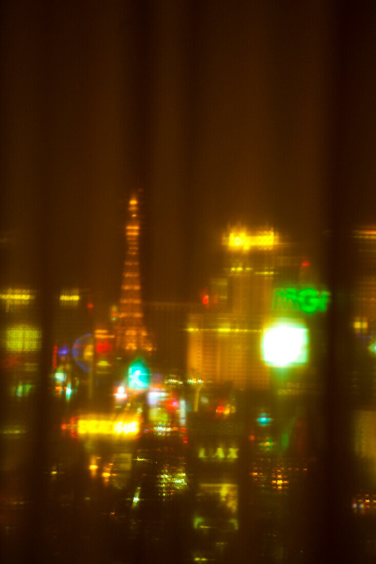 A view across the city of Las Vegas at night, Buildings on the Strip, Entertainment venue, Blurred image