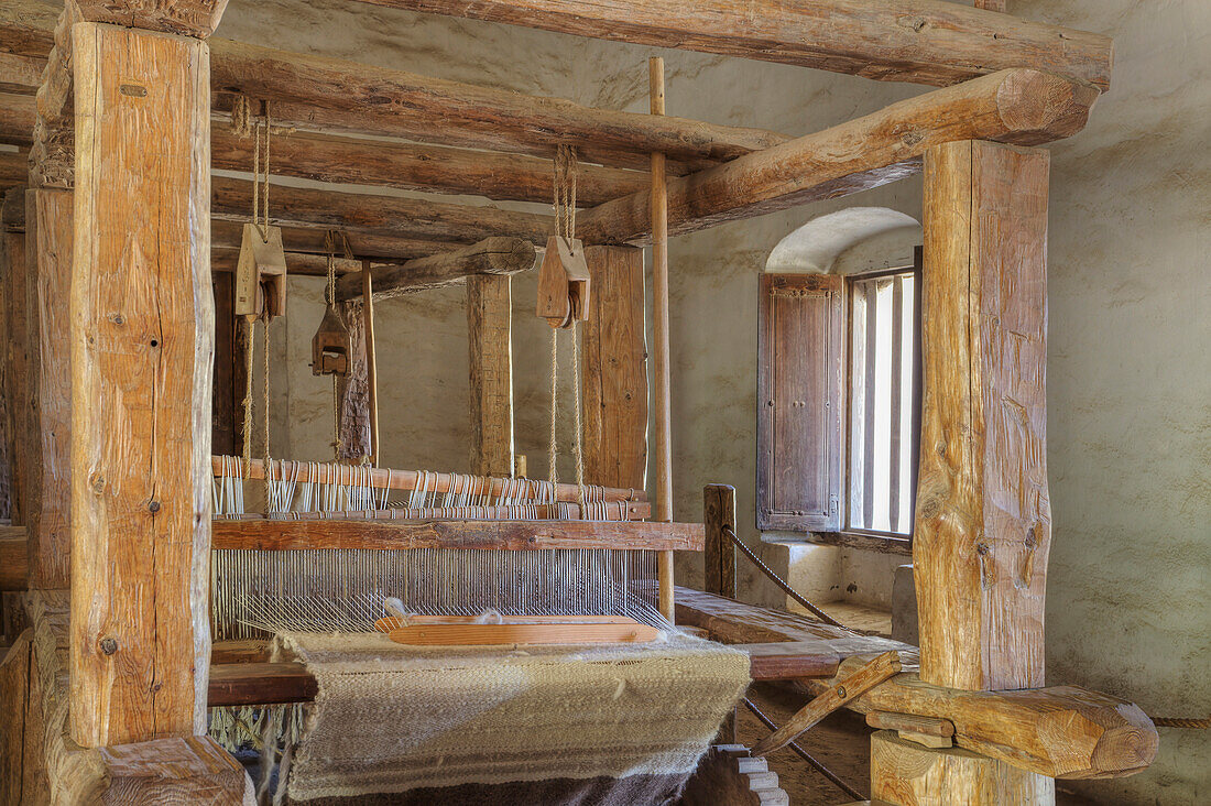 Carding and Spinning Wool, Weaving yarn into cloth on loom, Mission La Purisima State Historic Park, Lompoc, California, Founded in 1787, the eleventh mission of the twenty-one Spanish Missions established in California