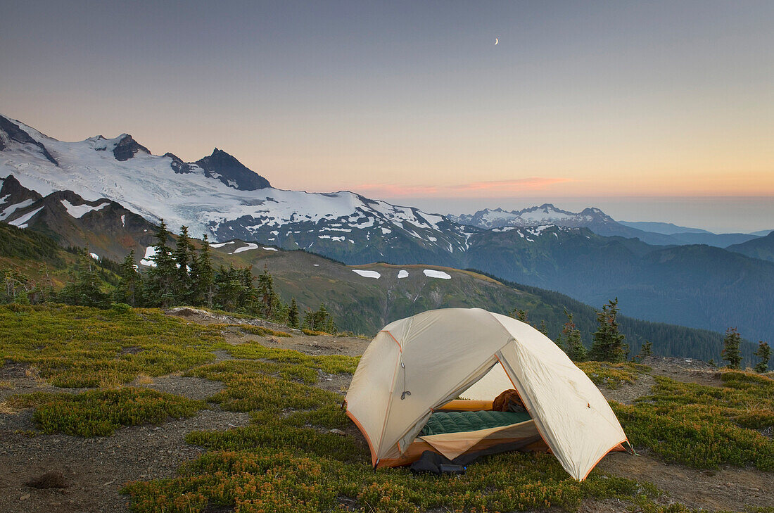 Alpenglow, the view at sunset at a backcountry campsite on Skyline Divide in the Mount Baker Wilderness, North Cascades in Washington state
