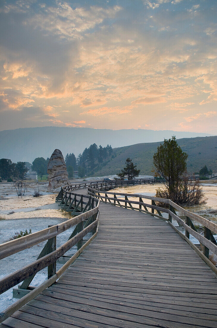 Boardwalk over the waters and landscape of the hot springs in Grassy Springs at Mammoth Hot Springs, Yellowstone National Park, in Wyoming