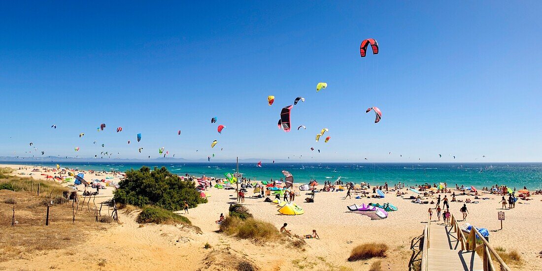 Kitesurfing Along The Beach Of Punta Paloma, Cadiz, Spain