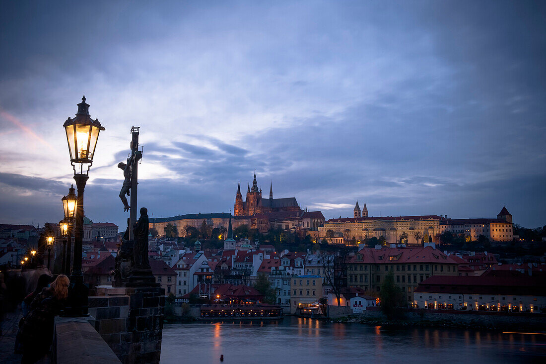 Charles bridge at dusk with view of the old town of Prague, Prague, Czech Republic