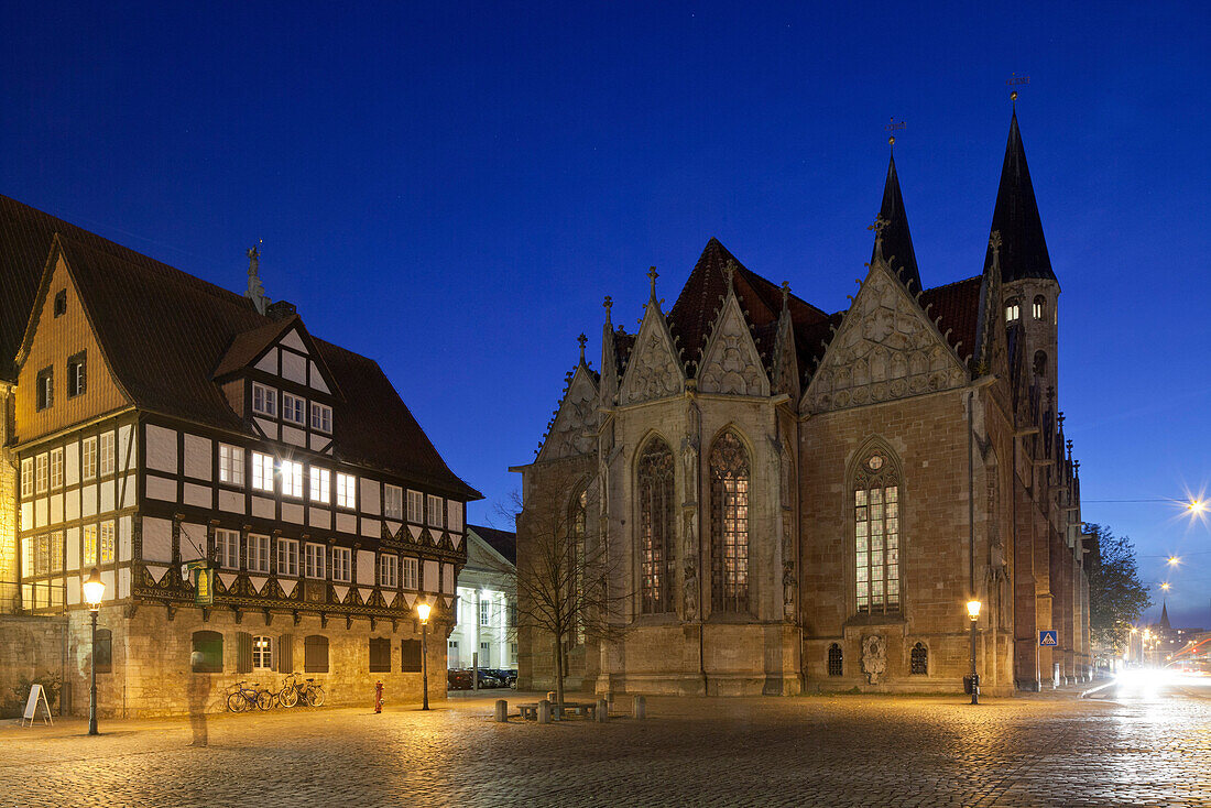 Historic old market square at night in gothic style with St. Martini church and Gewandhaus, blue hour, Brunswick, Lower Saxony, Germany