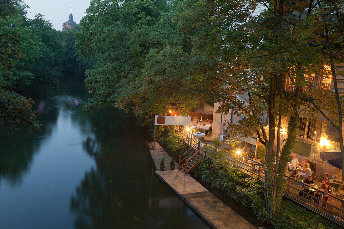 Oker old city ramparts, banks of the river with cafe and restaurant, Brunswick, Lower Saxony, Germany