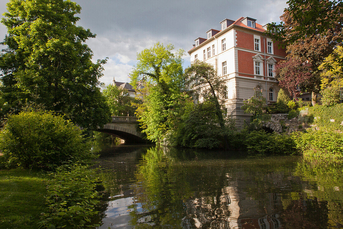 Residential building along the river Oker which encircles the medieval town and formed part of the defences, Brunswick, Lower Saxony, Germany