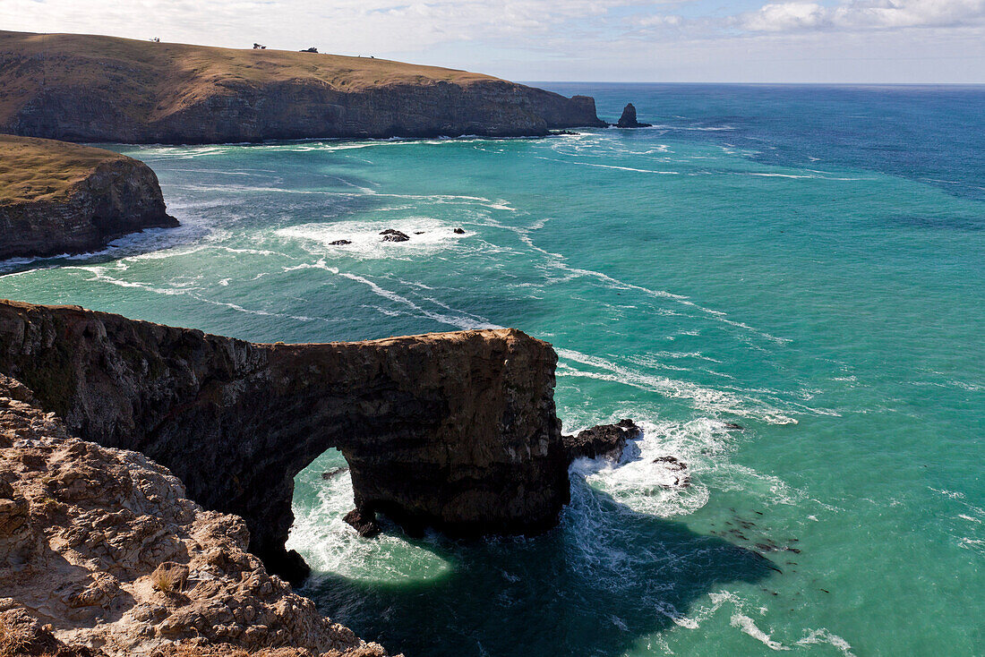 blocked for illustrated books in Germany, Austria, Switzerland: Sea arch along the rocky coast on the Banks Track Walk, damaged in the 2011 earthquake, Banks Peninsula, Canterbury, South Island, New Zealand