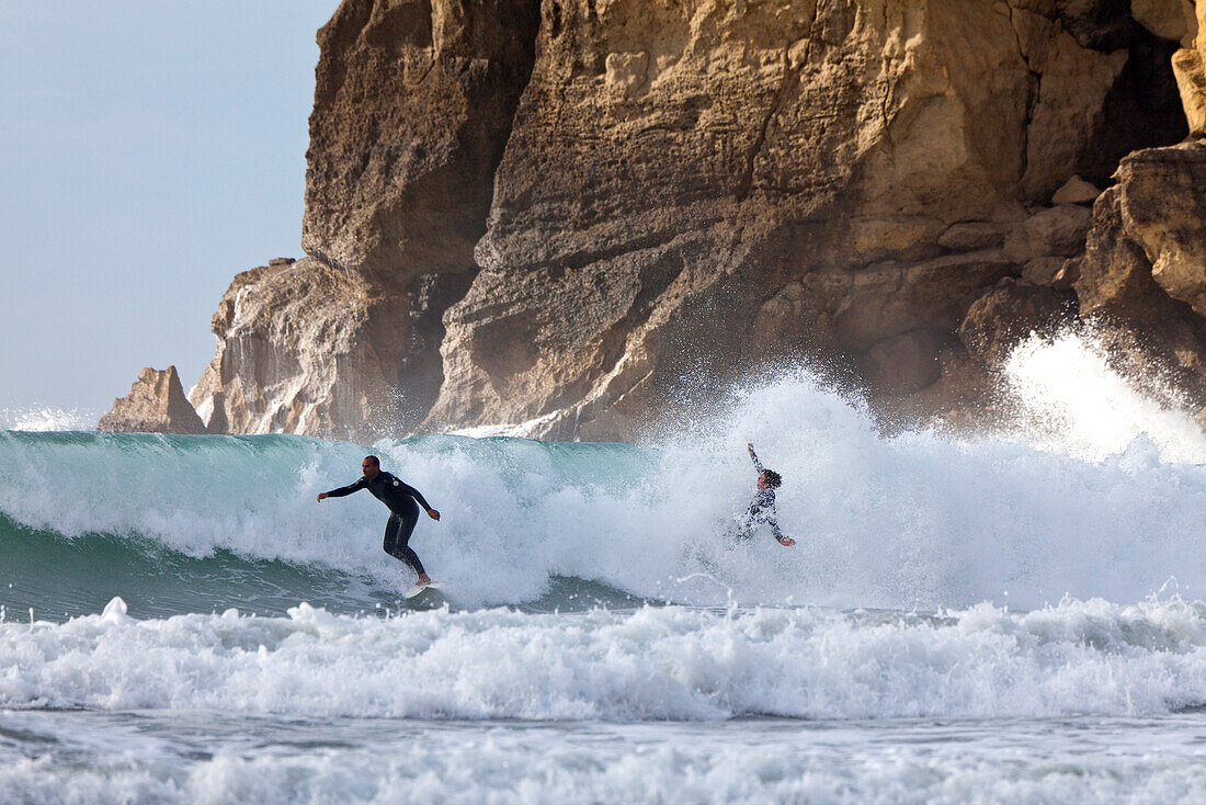 blocked for illustrated books in Germany, Austria, Switzerland: Surfer near cliffs at Castle Point, East coast, North Island, New Zealand