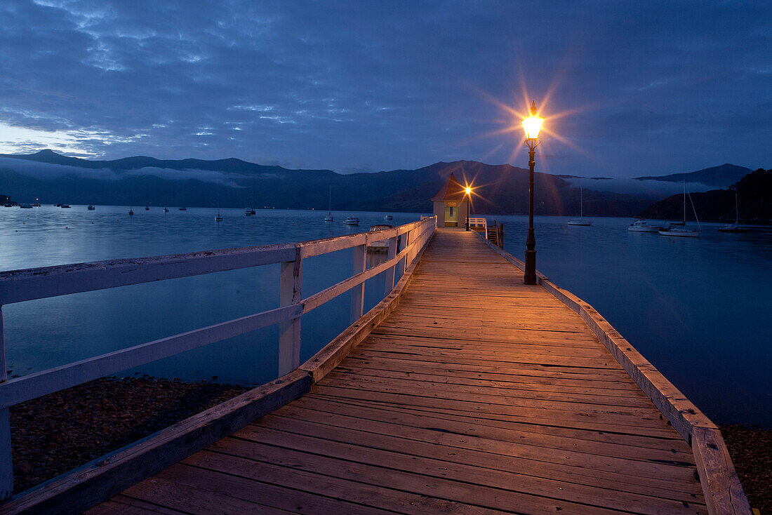 Sunset at the pavilion on Daly's Wharf, Akaroa jetty Banks Peninsula, Canterbury, South Island, New Zealand