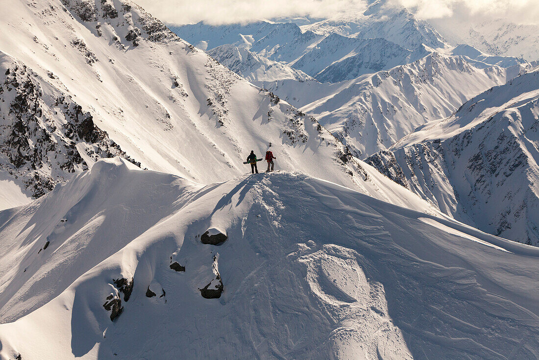 Aerial of Snowboarder standing on a mountain peak, South Island, New Zealand